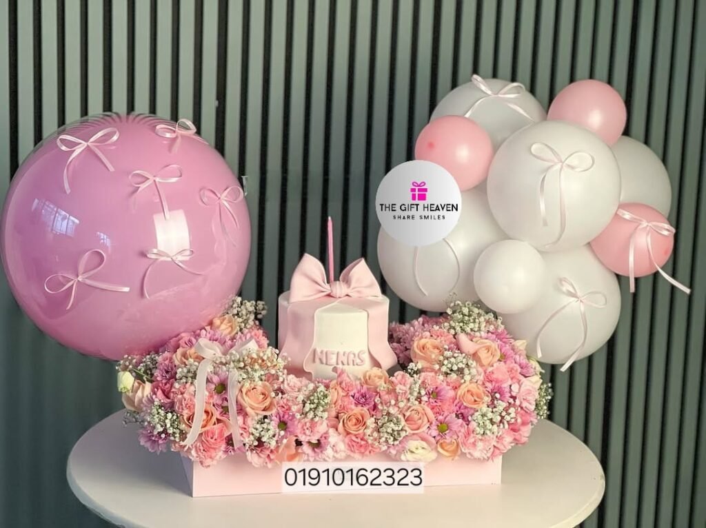 Luxury cake and floral decoration with balloons